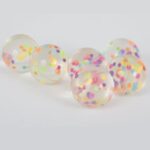 8 CONFETTI FILLED BOUNCY BALLS-NET BAG